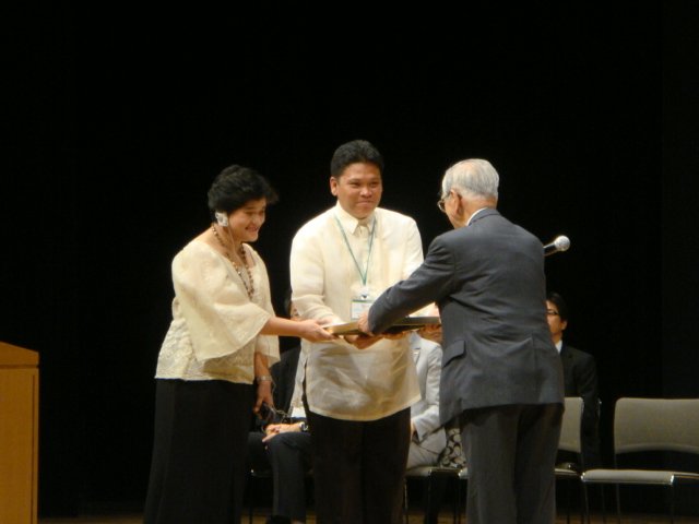 NHE officials receiving the award
