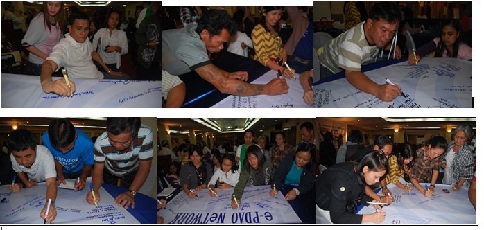 Jorwin Bautista (left) among the first to sign, Joerabs (middle) signs on behalf of Opol Fed.of PWDs, the rest saying while signing, “Sali tayo dyan!’”